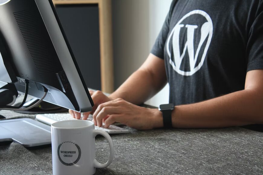 The image shows a person working on Wordpress