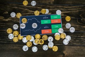The image shows some crypto coins on a table