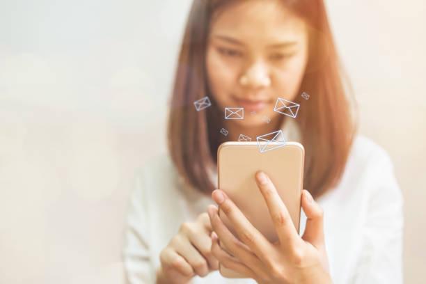 A person is holding a mobile phone working on advertising.