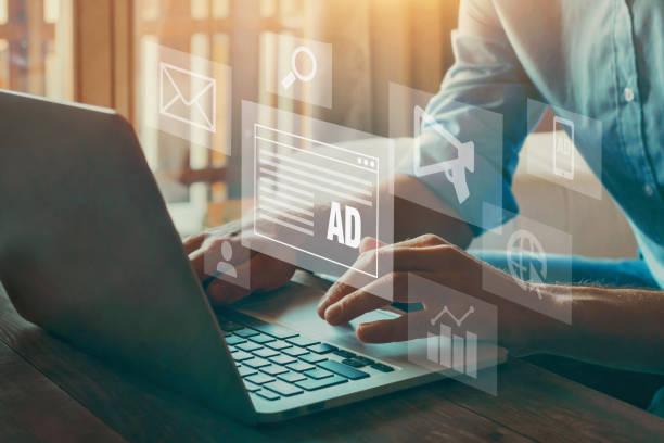 A person is using a laptop as a toolbox for display advertising.