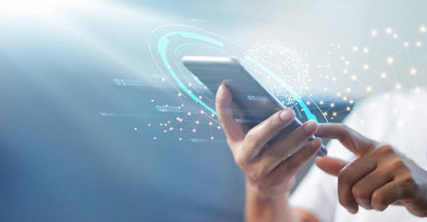 A persons is holding a mobile phone working on advertising