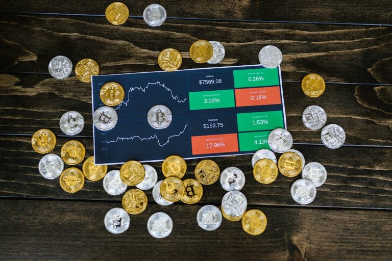 The image shows some crypto coins on a table